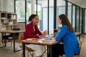 Team leader doing check-ins with her teammate.